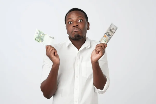 Young Attractive African Man Holding Usa Currency Euro Currency Deciding — Stock Photo, Image