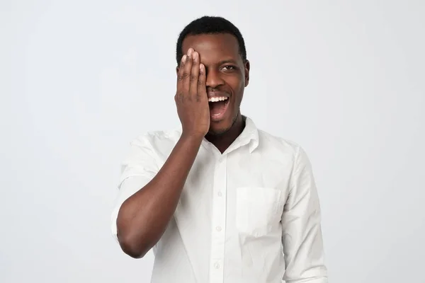 African Young Man White Shirt Covering Half Face Hand While — Stock Photo, Image