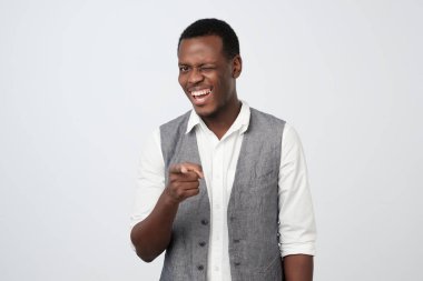 Smiling business man point you saying You are excellent.