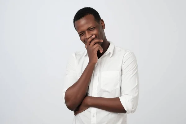 Sly cunning african man touching chin with finger and looking away. Handsome guy thinking. — Stock Photo, Image