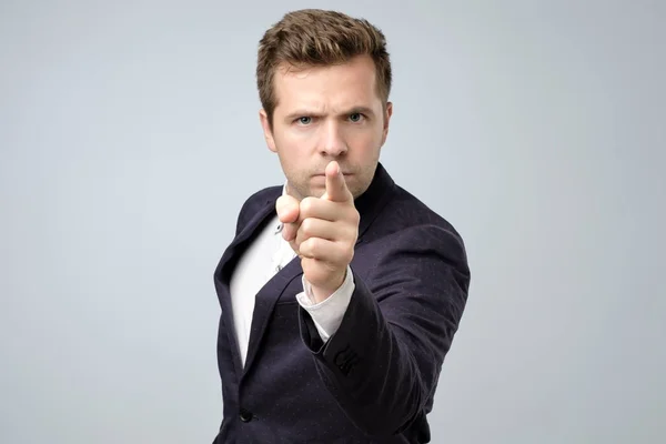 Young business man pointing with finger to the camera and to you — Stock Photo, Image