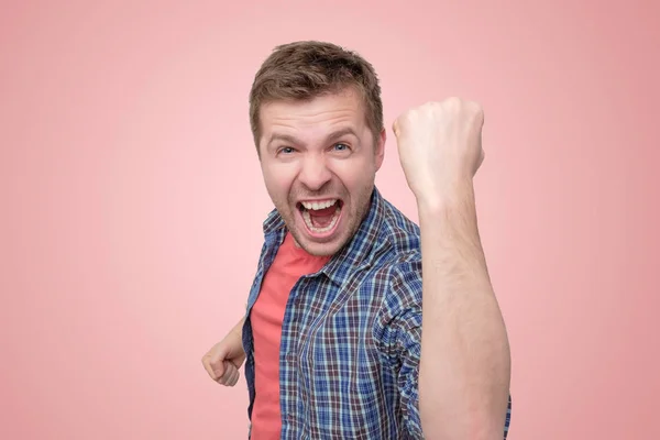 Man looking so excited putting his fist up — Stock Photo, Image