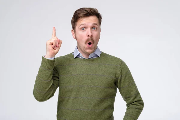 stock image man pointing with finger up having a great idea