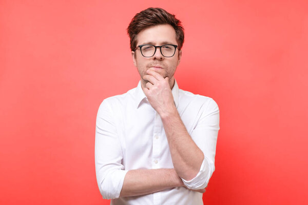 young caucasian man making a hard decision