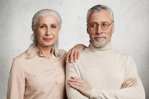 Photo of senior elderly couple demonstrate their true love to each other, have good relationships, experienced many positive and negative events in life together, being inseparable and supportive