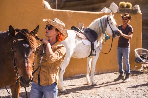 Nice Caucasian Couple Outdoor Prepare Check Horse Equipments Ready Live — Stock Photo, Image