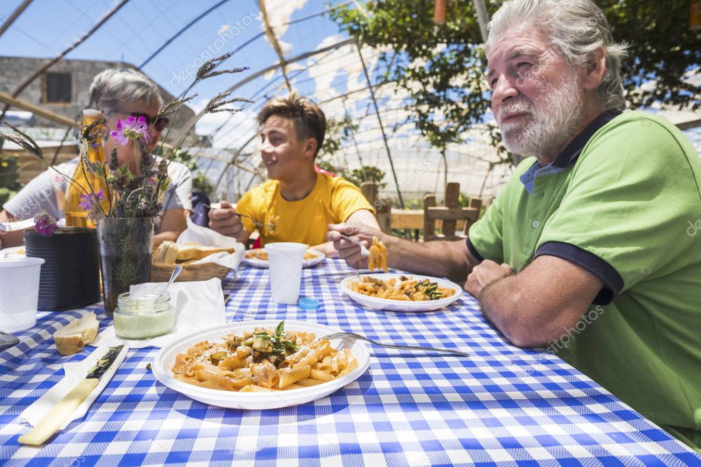 family eating together in alternative natural place restaurant 