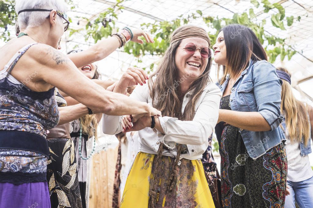group of crazy women in hippy style dress at party