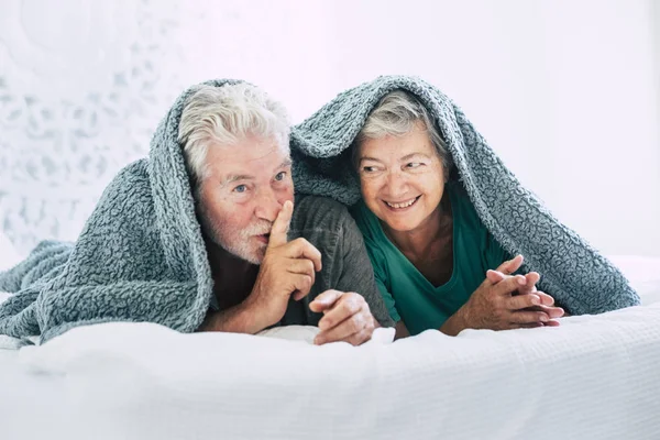 Aged Couple Lying Bed Plaid Having Fun — Stock Photo, Image