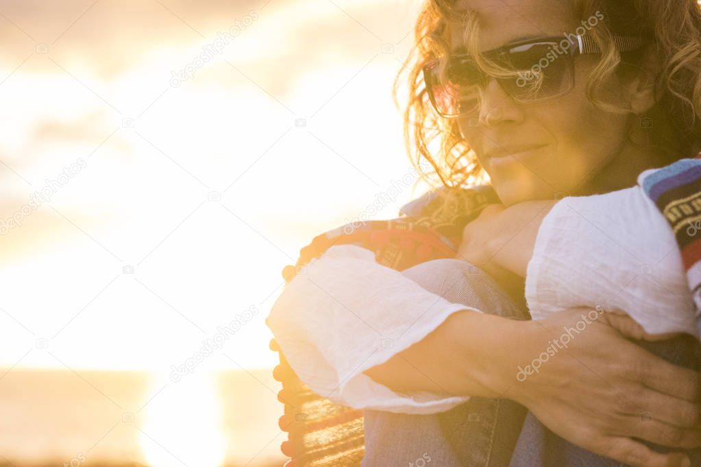 woman enjoying sunset outdoor on ocean coast