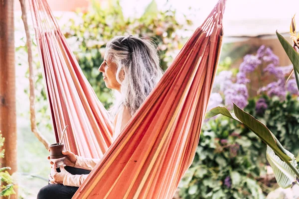 Beautiful White Hair Caucasian Lady Sitting Coloured Hammock Drinking Tea — Stock Photo, Image