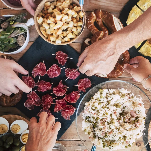 top view of table with mixed chef food during dining party