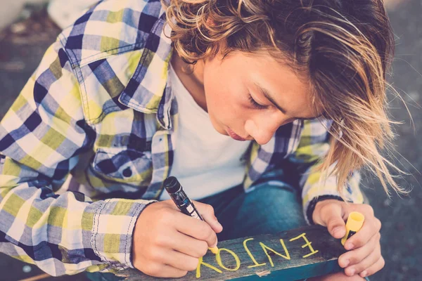 Young Caucasian Boy Male Write Sign Enjoy Message Wooden Piece — Stock Photo, Image