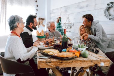 Family enjoy together christmas lunch at home, caucasian people having fun in friendship celebrating holidays and eve clipart