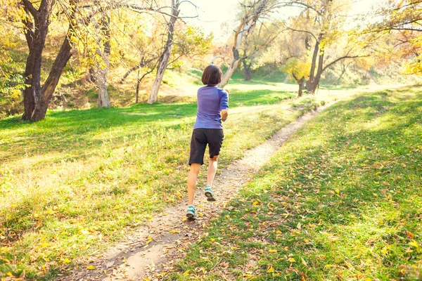 Girl Runs Autumn Park Slender Woman Trains Nature Sports Forest — Stock Photo, Image