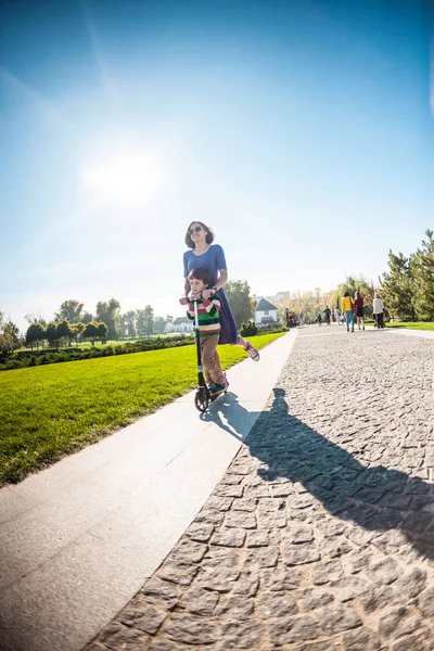 Boy His Mother Rides Scooter Child Spends Time Parent Park — Stock Photo, Image