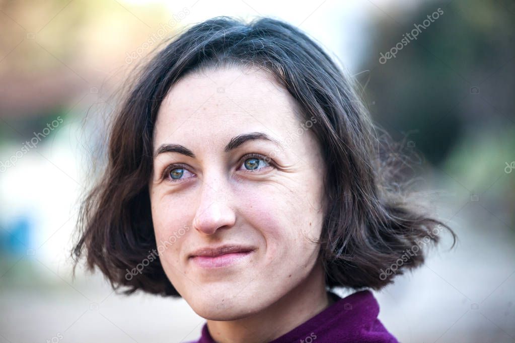 Portrait of a smiling brunette.