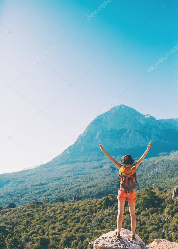 Girl at the top of the mountain.