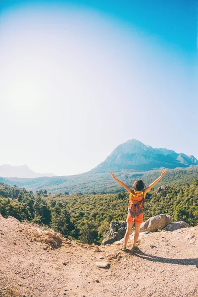 Girl at the top of the mountain.