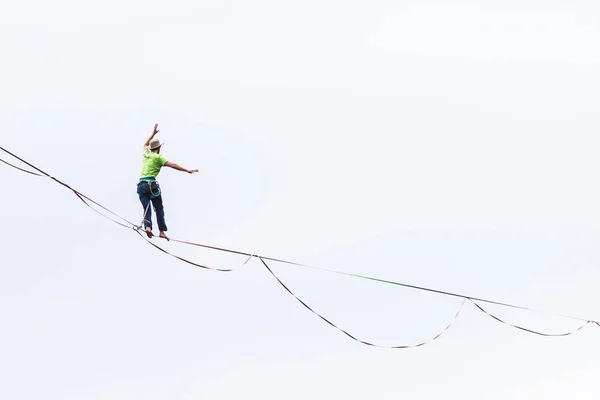 Highline on the background of the cloudy sky makes a move.