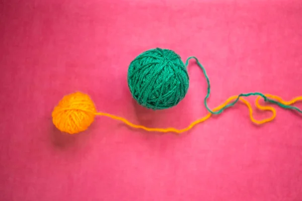Two balls of wool on a pink background. — Stock Photo, Image