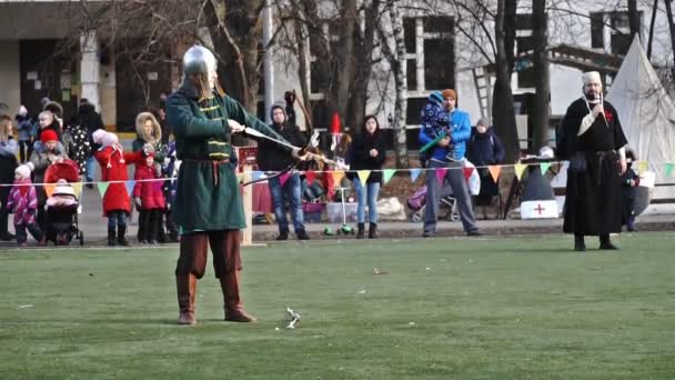 Moscow, Russia - November 17,2018. Medieval archer shoots an arrow from a bow. — Stock Video