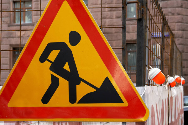Road works traffic sign on the Moscow street in front of a repairing area