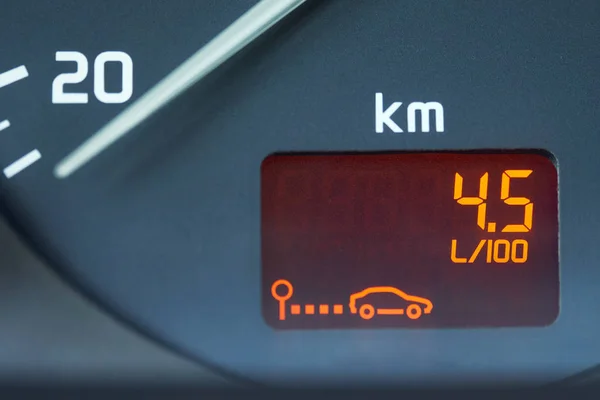 Low fuel consumption showed by the car on-board computer on the dashboard
