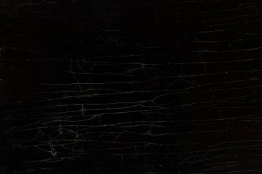 Çatlak bir masanın ahşap arka planı. Uzun çatlaklı koyu renkli bir masa.