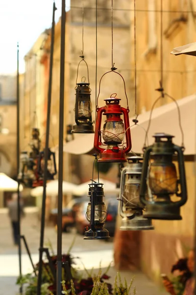 Hanging colorful vintage gas lamps, outdoor cafe decor