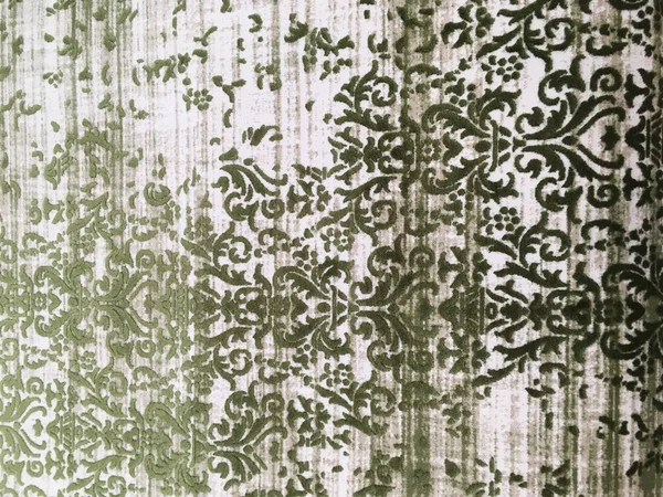 Old worn out elegant damask pattern carpet / floor covering. Abstract luxury grunge vertical background