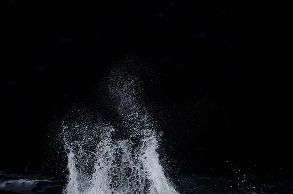 Splashing wave on the Black sea in the night.