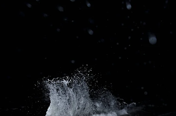 Splashing wave on the Black sea in the night.