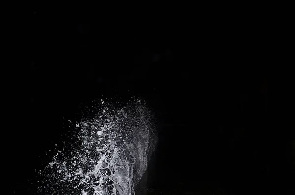 Splashing wave on the Black sea in the night.