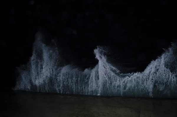 Splashing wave on the Black sea in the night.