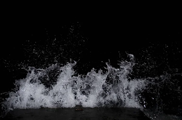 Splashing wave on the Black sea in the night.