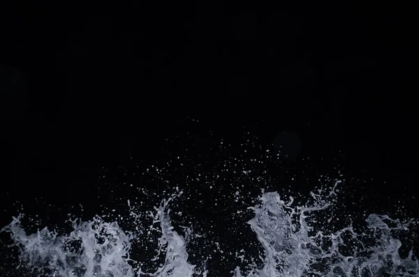 Splashing wave on the Black sea in the night.