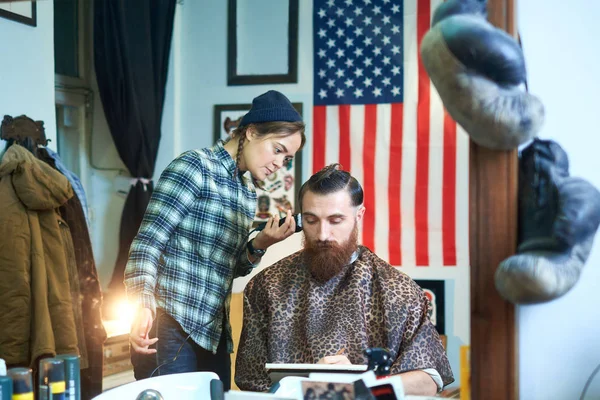 Photo of hipster man getting haircut by hairdresser — Stock Photo, Image