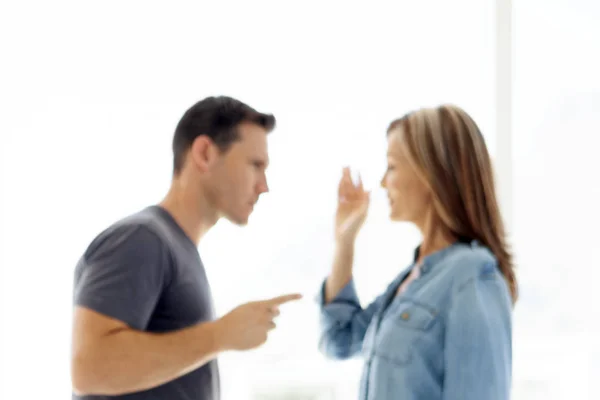 couple issues - man and woman arguing about personal problems in their relationship - blurred on purpose