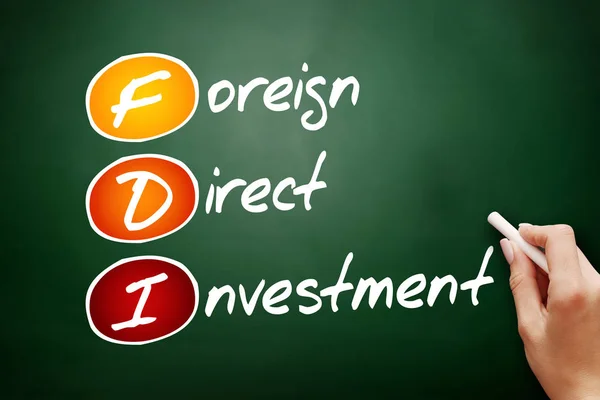 FDI - Foreign Direct Investment, acronym business concept on blackboard