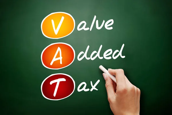 VAT - Value Added Tax, acronym business concept on blackboard
