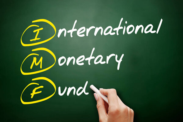 IMF - International Monetary Fund acronym, business concept on blackboard