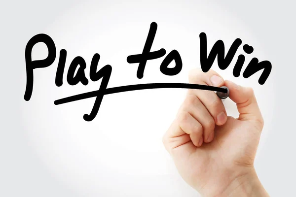 Play to Win текст с маркером — стоковое фото