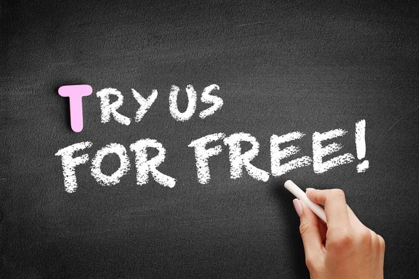 Try Us Free! текст на доске — стоковое фото