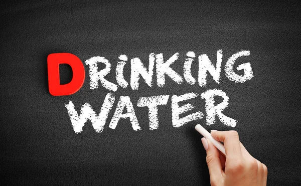 Drinking water text on blackboard — Stock Photo, Image