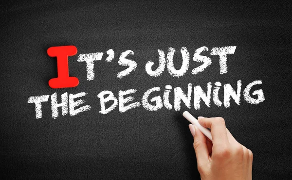 It's Just The Beginning text on blackboard — Stock Photo, Image