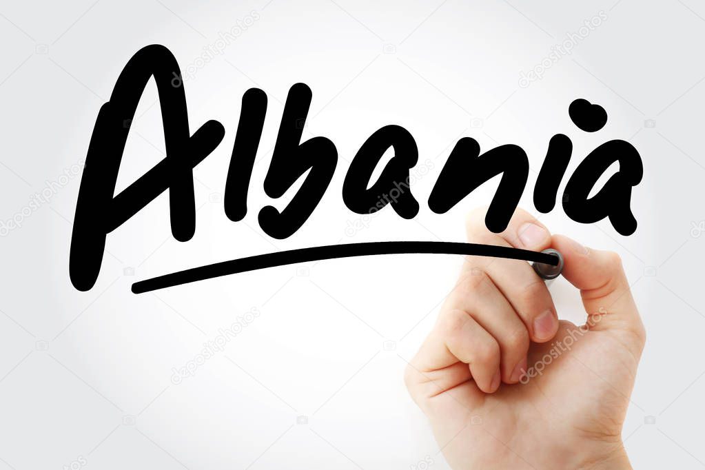 Hand writing Albania with marker