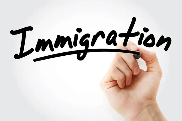 Hand skriva invandring med markör — Stockfoto