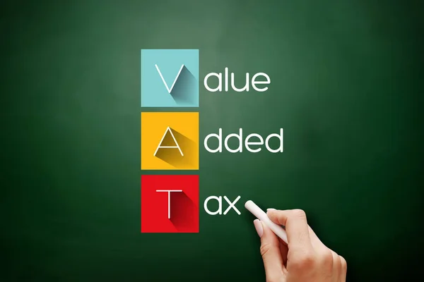 VAT - Value Added Tax, acronym business concept on blackboard