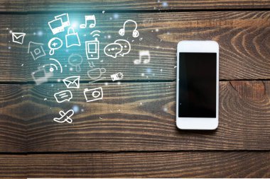 Ahşap arka planda akıllı telefon